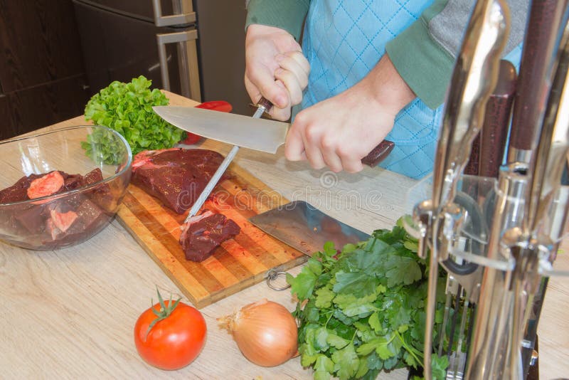Preparing Lean Meat. Hands of a Man Preparing Meat and Vegetables in a