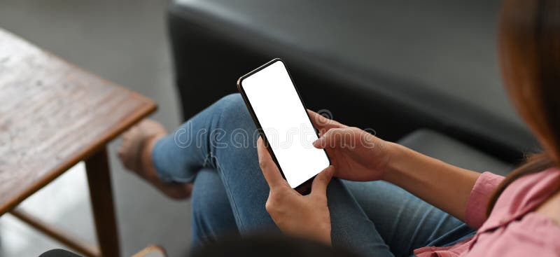 Cropped image of a beautiful woman is using a mockup smartphone. stock images