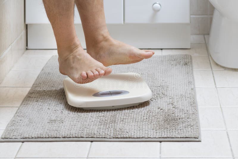 Cropped Image of Man Feet Jumping on Weigh Scale Stock Image Image of