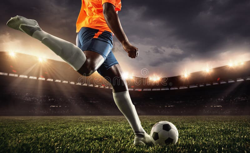 Cropped Male Soccer, Football Player Kicking Ball at the Stadium during  Sport Match on Dark Sky Background. Stock Image - Image of nation, gear:  222299317