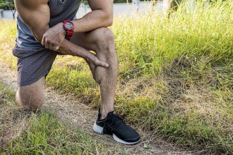 Cropped shot of an athletic man having calf muscle cramps. Endurance issues during outdoor run