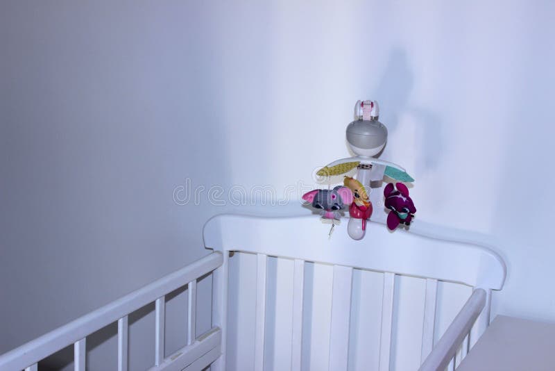 White Baby Bed For Newborn Over White Wall Background. White Interior For Baby Boom. stock photos White Baby Bed For Newborn Over White Wall Background. White Interior For Baby Boom. stock photos