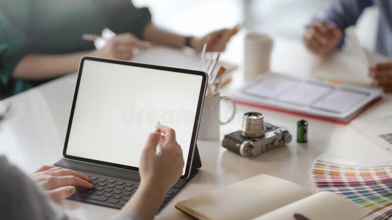 Cropped shot of female application developer working on blank screen tablet royalty free stock photo