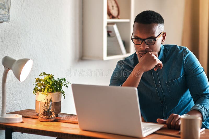 I wonder what I should do here. Cropped shot of a handsome young businessman sitting in his home office and looking