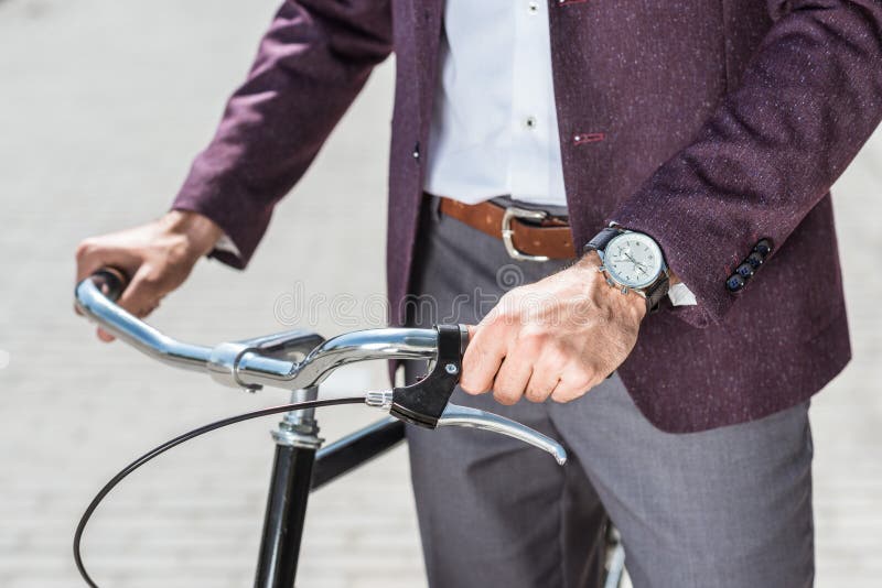cropped shot of man in stylish suit and wristwatch