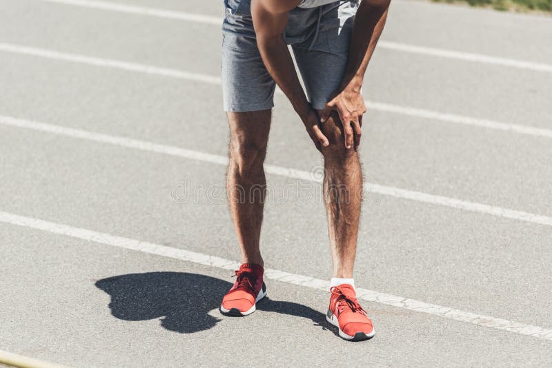 Cropped Shot of Runner with Knee Injury Stock Image Image of people