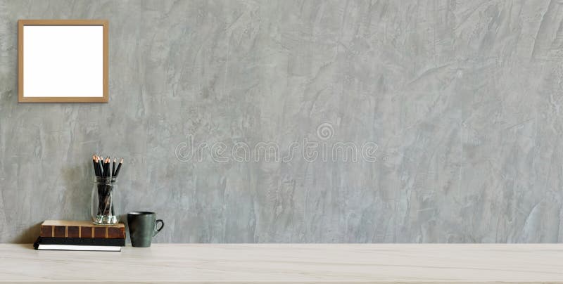 Cropped shot of trendy workplace with copy space and office supplies on marble background and loft grey wall royalty free stock photography