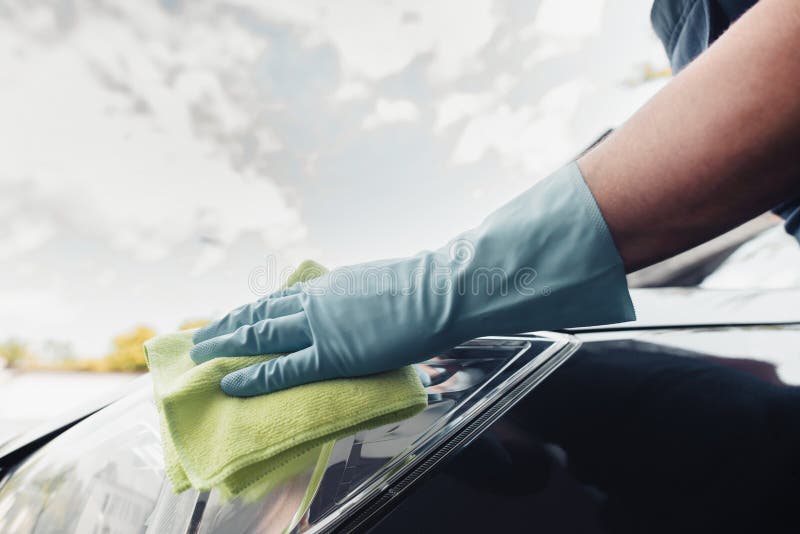 View of Car Cleaner in Rubber Glove Wiping Car with Rag Stock Image