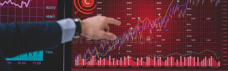 Cropped view of computer systems analyst pointing with finger at graphs on computer monitor royalty free stock photography
