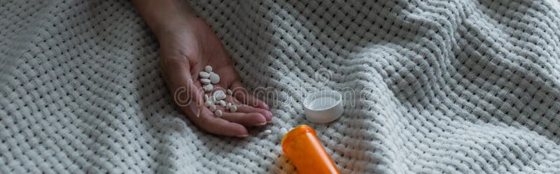 cropped view of depressed woman with climax holding pills in hand, banner,stock image