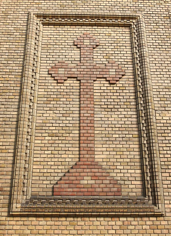 Cross on a brick wall stock photo. Image of details, construction