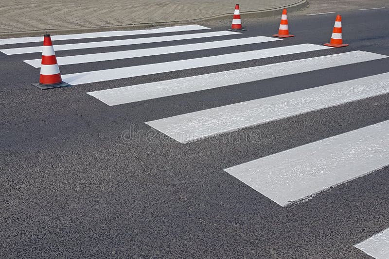 The cross-decorated pedestrian crossing with the still not dried out red. Restriction of traffic by road signs. Update road pedest royalty free stock photography The cross-decorated pedestrian crossing with the still not dried out red. Restriction of traffic by road signs. Update road pedest royalty free stock photography