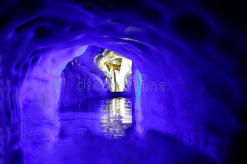 Cross inside the Natural Ice Palace Ice Cave at the top of Hintertux Glacier., Austria.