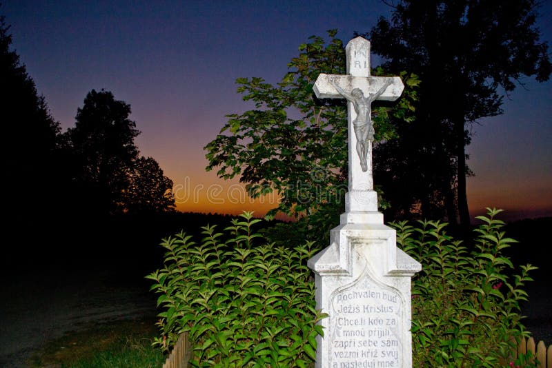 Cross with Jesus at sunset stock images