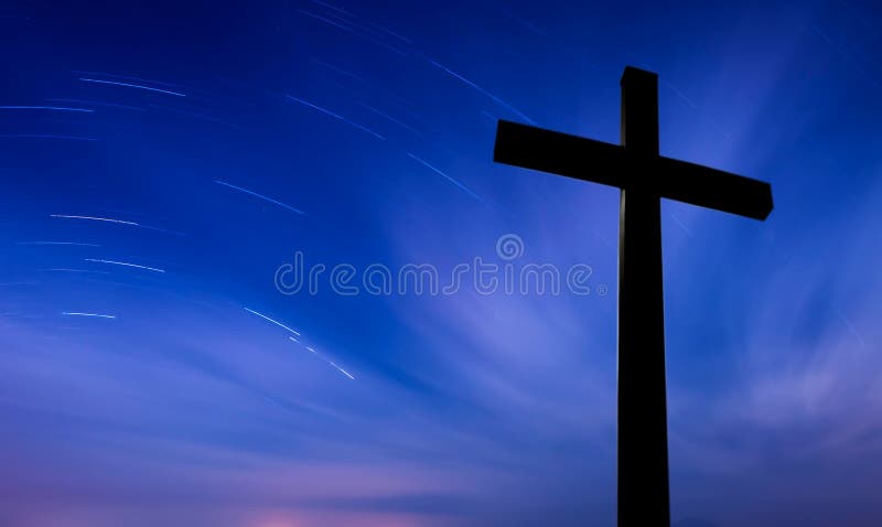 Cross over starry sky background concept of religion