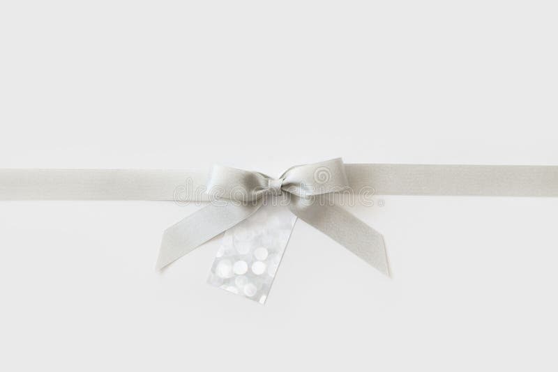 Silver Ribbon with a Bow As a Gift on a White and Pink Background Stock  Image - Image of beautiful, holiday: 157073779