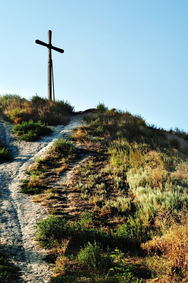 Cross on top of mountain