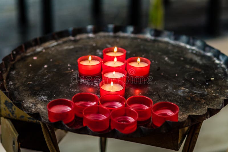 Cross of votive candles stock image. Image of memory 72134295