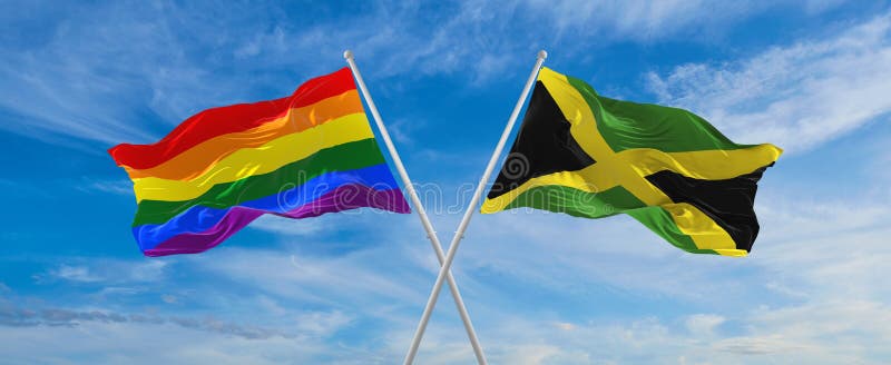 Crossed Flags Of Lgbt And Jamaica Flag Waving In The Wind At Cloudy Sky Freedom And Love