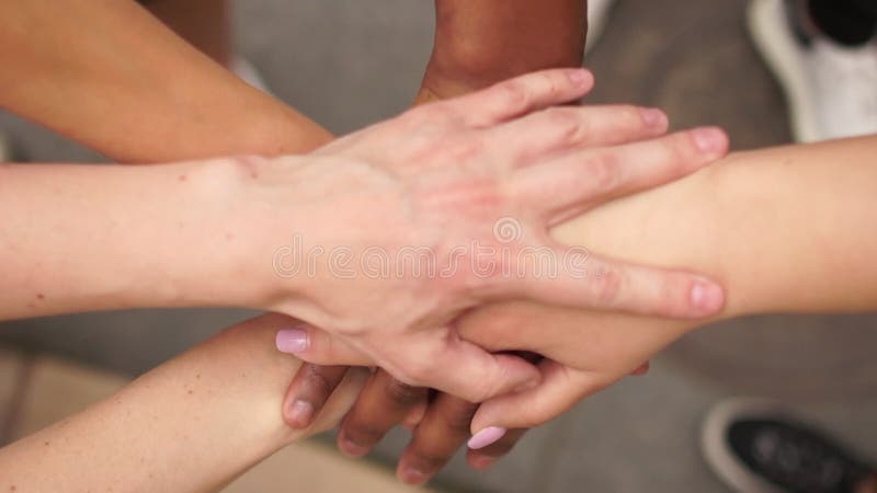 Crossed hands of people of different colors, multi-racial group of people, support and solidarity of the BLM movement