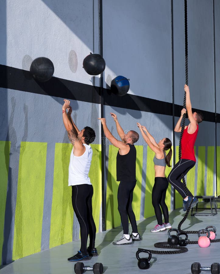 Crossfit Workout People Group with Wall Balls and Rope Stock Photo
