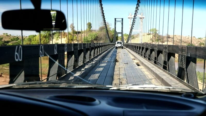 Crossing old famous eiffel bridge over madagascar river stock footage