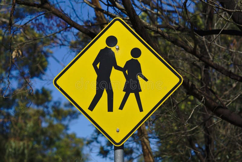 Children crossing road sign. Yellow diamond background. Traffic