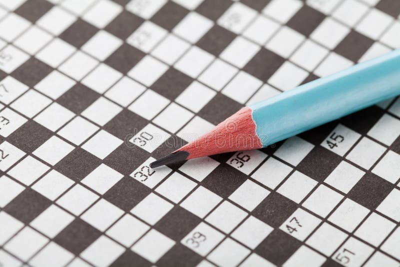 Crossword puzzle and blue pencil