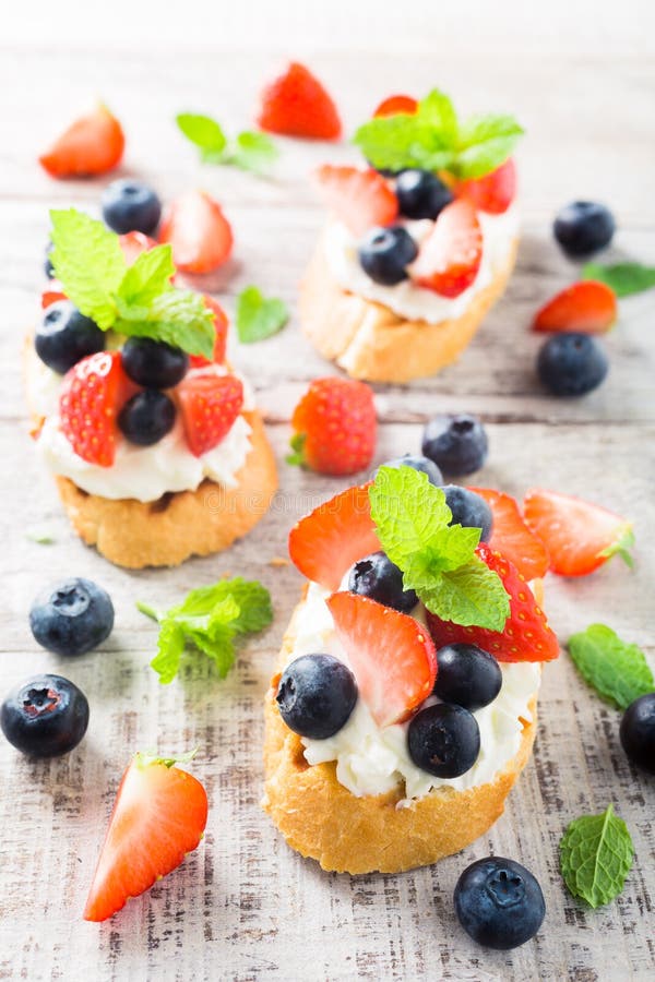 Crostini with grilled baguette, cream cheese and berries royalty free stock photo Crostini with grilled baguette, cream cheese and berries royalty free stock photo