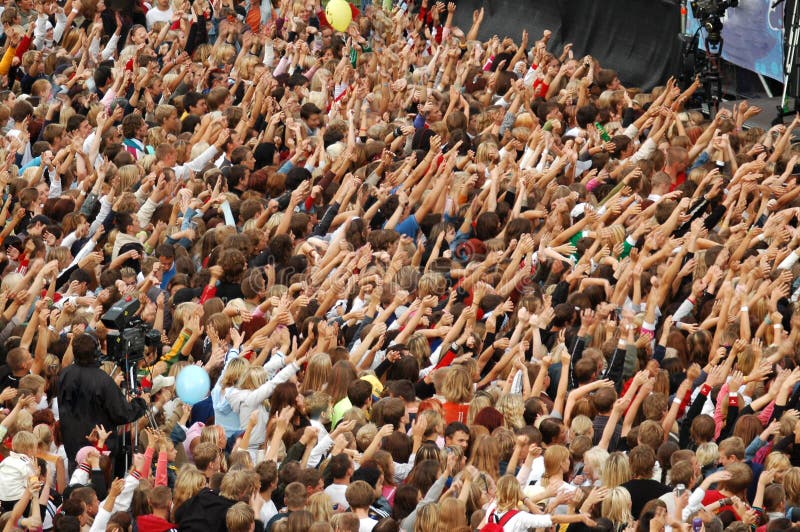 Crowd. Live texture shot of a cheering crowd at a local rock concert Crowd. Live texture shot of a cheering crowd at a local rock concert