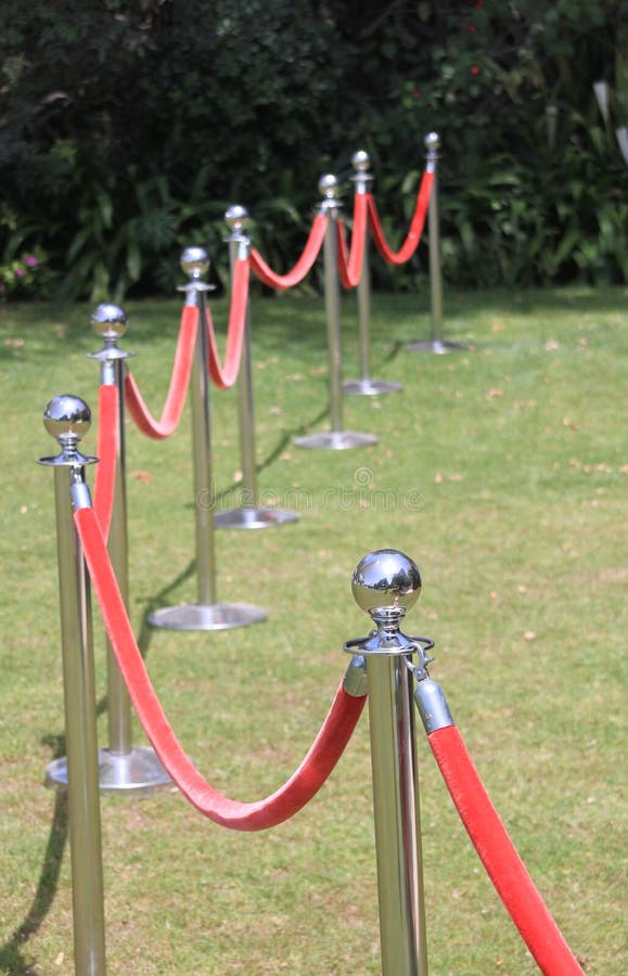 Red velvet rope barrier stock photo. Image of closed 143622206