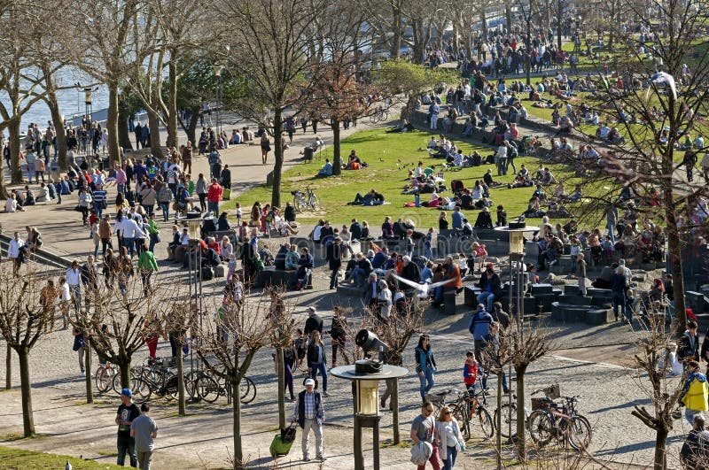 Crowd enjoying sunny weather on Rhine Promenade