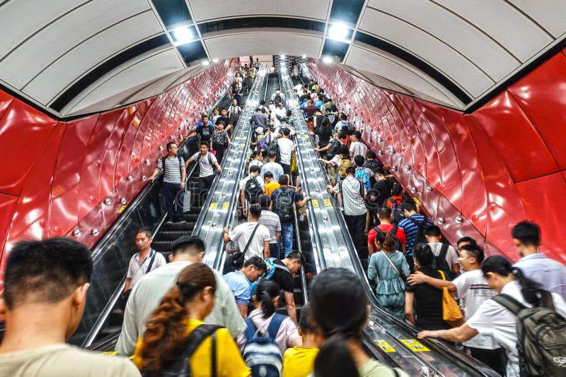 The crowd took the elevator in subway tunnel in Guangzhou, China