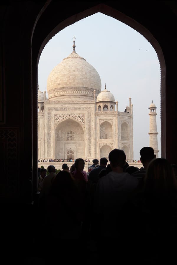 Crowd of tourists going to the temple of The Taj Mahal through an arch, filmed in the city of Agra, India in November 2009 stock photo Crowd of tourists going to the temple of The Taj Mahal through an arch, filmed in the city of Agra, India in November 2009 stock photo