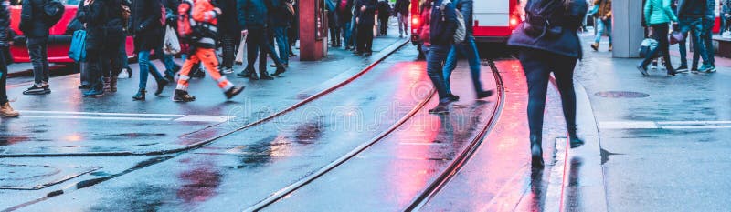 Crowd of unrecognizable people walking in street city center - Concept of modern, rushing, urban, city life, business, shopping -. Focus on street asphalt stock photo Crowd of unrecognizable people walking in street city center - Concept of modern, rushing, urban, city life, business, shopping -. Focus on street asphalt stock photo