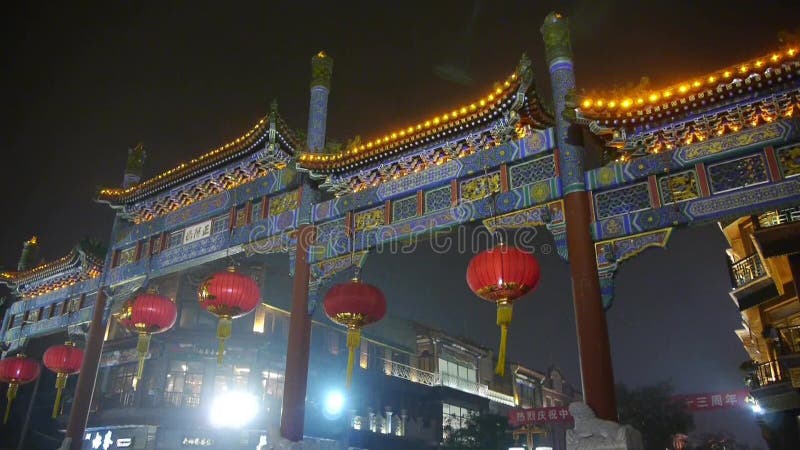 Crowd walk on Chinatown,China Beijing night market,memorial arch & lantern.