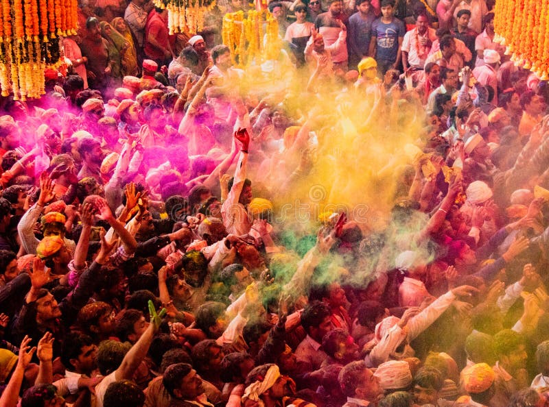 Crowds can be seen below duirng Holi Festival in India, throwing