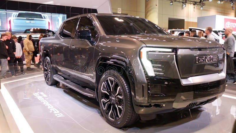 Crowds looking at new car models at Auto show. GMC car on display. National Canadian Auto Show with many car brands. Toronto ON stock images