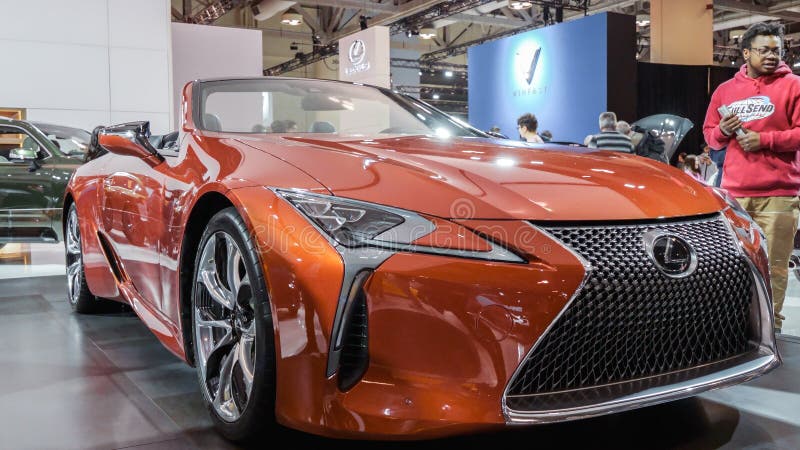 Crowds looking at new car models at Auto show. Lexus car on display. National Canadian Auto Show with many car brands. Toronto ON stock image