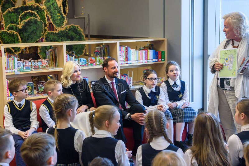 Crown Prince Haakon , Crown Princess Mette-Marit of the Kingdom of Norway meeting with children at National Library of Latvia
