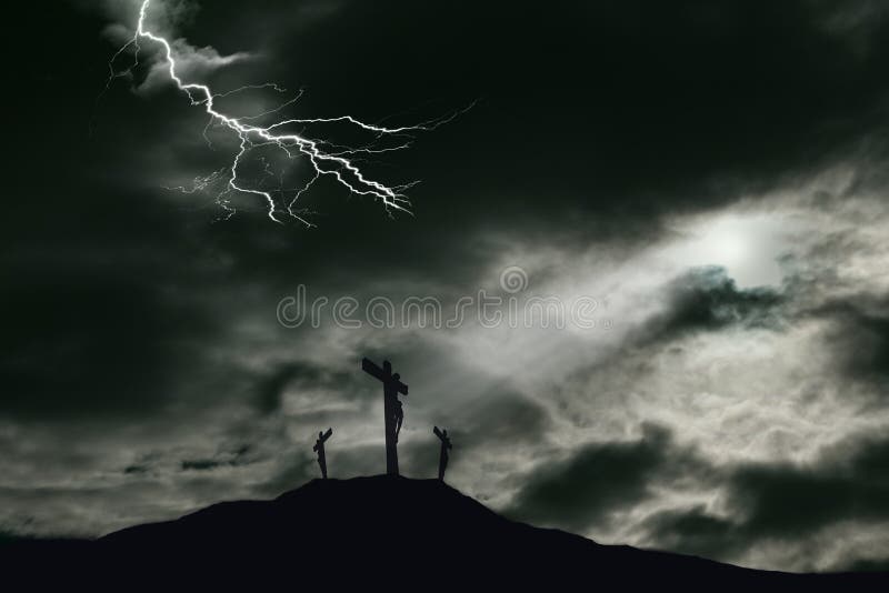 A depiction of the crucifixion of Jesus Christ on a cross with 2 other robbers nearby on Calvary. The sky is darkened with lightning and rays of light break through the clouds onto the cross for drama. Concept of the death of Jesus on Good Friday and His resurrection on Easter Sunday. Horizontal orientation with copy space. A depiction of the crucifixion of Jesus Christ on a cross with 2 other robbers nearby on Calvary. The sky is darkened with lightning and rays of light break through the clouds onto the cross for drama. Concept of the death of Jesus on Good Friday and His resurrection on Easter Sunday. Horizontal orientation with copy space.