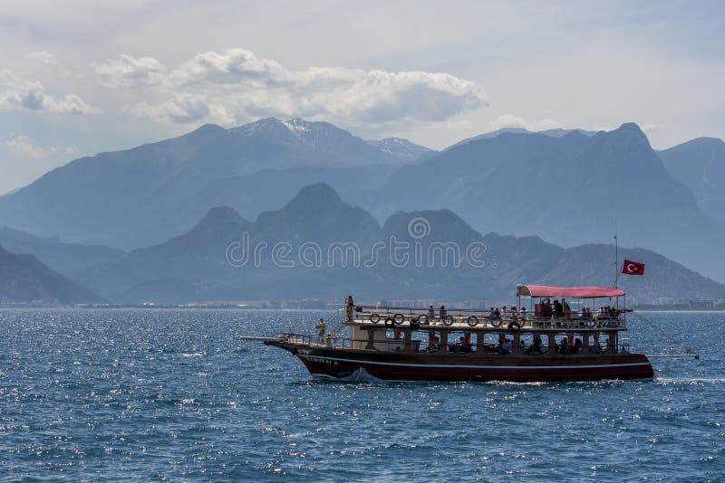 A cruise boat sails through Antalya Bay in Antalya, Turkey. royalty free stock images A cruise boat sails through Antalya Bay in Antalya, Turkey. royalty free stock images