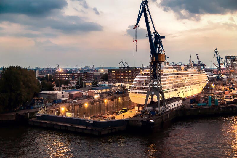 Cruise ship in dry dock in Hamburg harbor in the evening