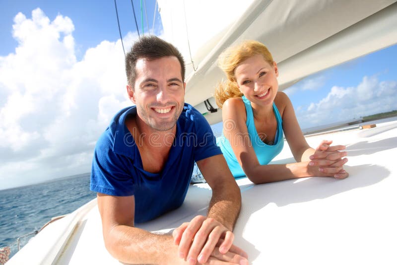 Cheerful couple cruising on a sail boat. Top smiling cheerful stock images, royalty-free photos and pictures