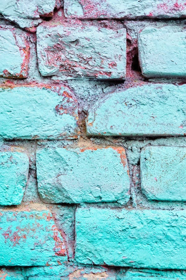 A Crumbling Brick Wall As a Texture Painted Turquoise Color Stock Photo