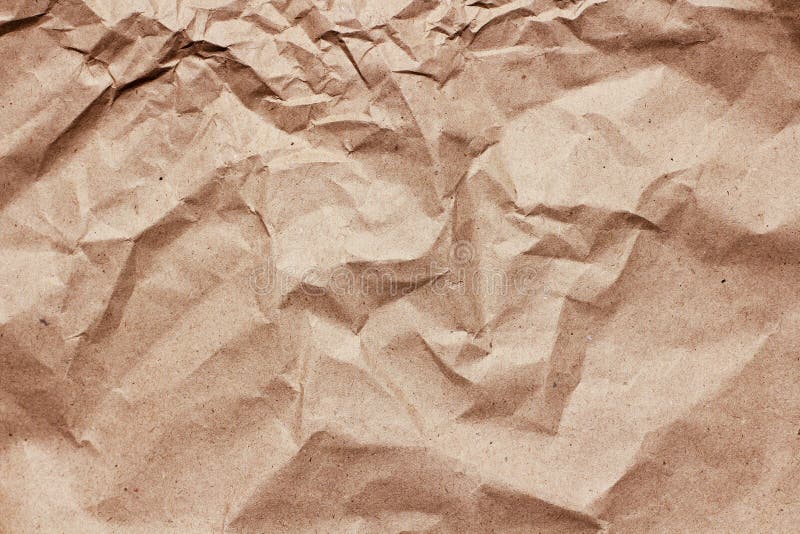 Crumpled brown craft paper background texture. Old paper sheet. Vintage letter template.