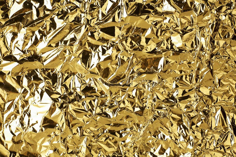 Crumpled golden foil shining texture background, bright shiny gold luxury design, metallic glitter surface royalty free stock photography Crumpled golden foil shining texture background, bright shiny gold luxury design, metallic glitter surface royalty free stock photography