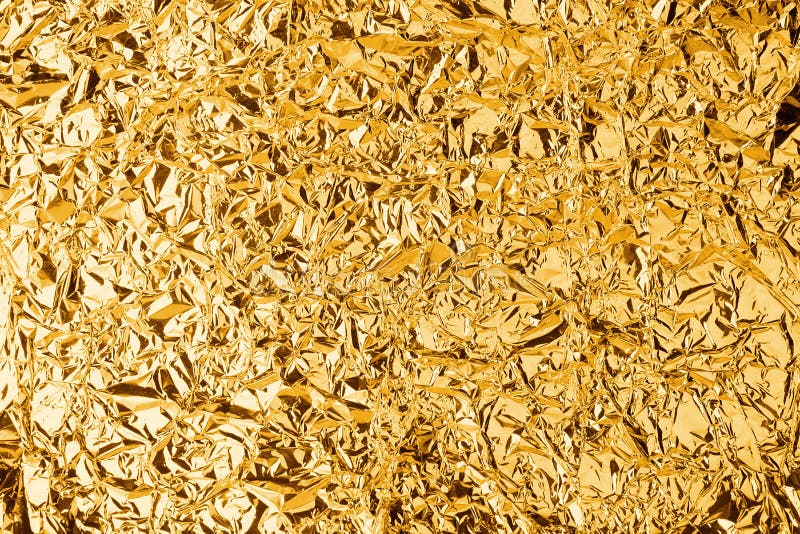 Crumpled golden foil shining texture background, bright shiny gold luxury design, metallic glitter surface