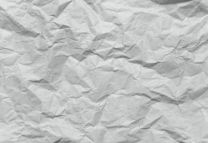 Crumpled gray recycled packing paper background stock images