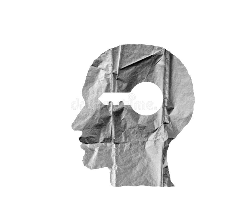 Crumpled paper shaped as a human head and key on white.